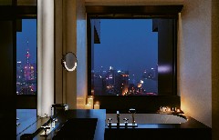 The bathroom of a room by night at The Bvlgari Hotel Shanghai